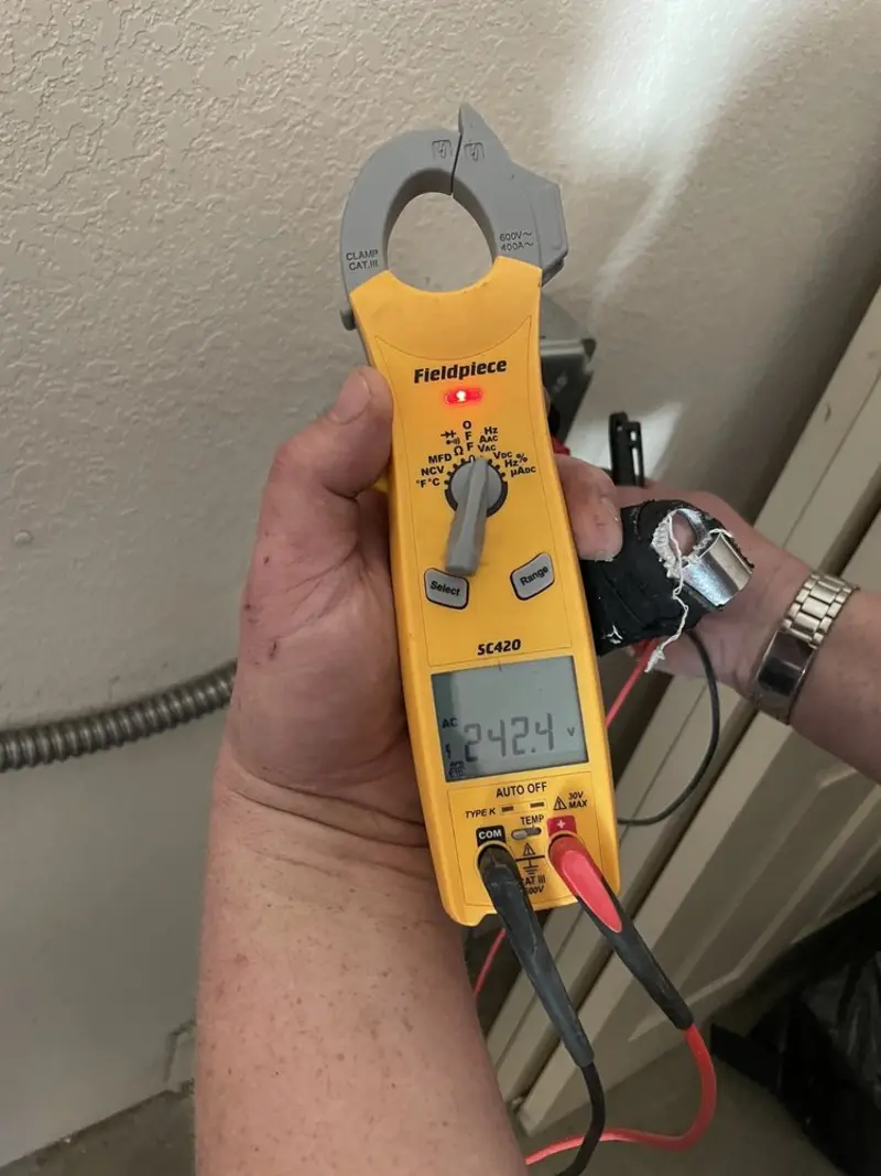 Voltage testing with clamp meter during Electrical Installation Services in Madison